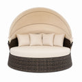 Outdoor Wicker Daybed with Adjustable Canopy and Beige Cushions